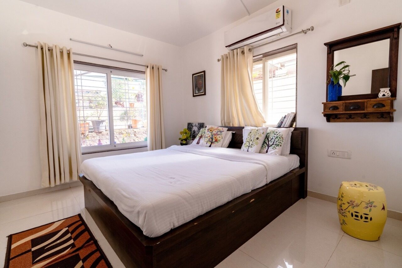 Bedroom with colourful cushions